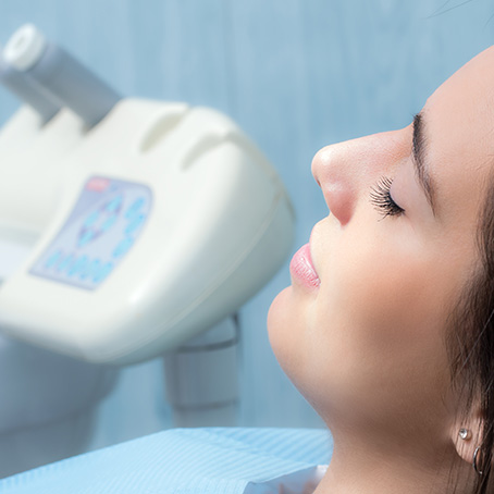 woman at the dentist with eyes closed
