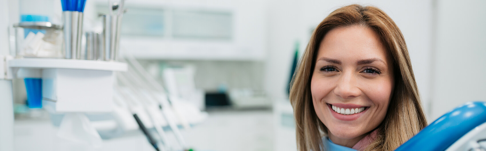 smiling woman sitting in a dental chair