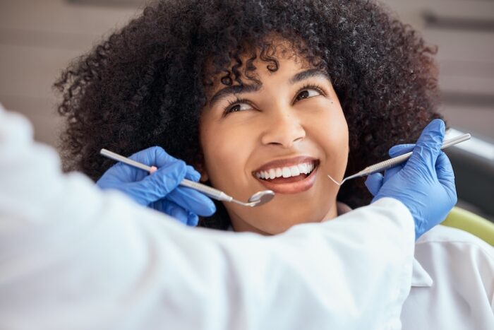 woman at dentist for a dental cleaning, routine visit